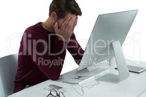 Stressed man sitting at desk