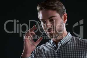 Man talking on glass mobile phone