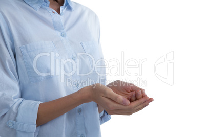 Mid-section of woman pretending to hold an invisible object