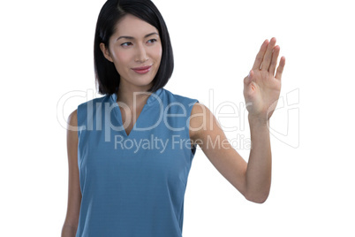Female executive touching invisible screen