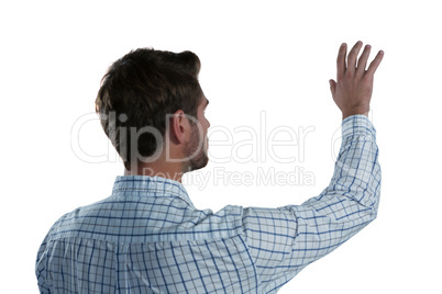 Man pretending to touch an invisible screen Man pretending to touch an invisible screen