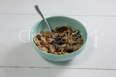 Bowl of wheat flakes with blueberry
