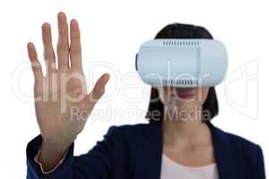 Businesswoman gesturing while using virtual reality headset