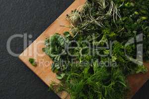 Various herbs on a chopping board