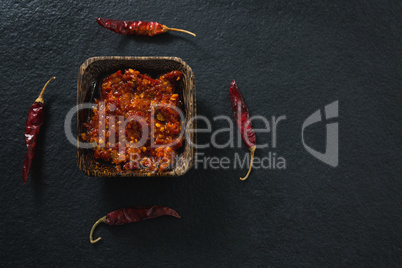 Chili pepper sauce in bowl with red chili