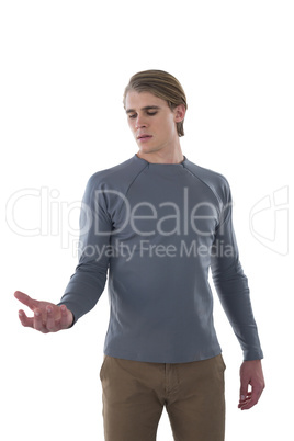Young businessman holding invisible product