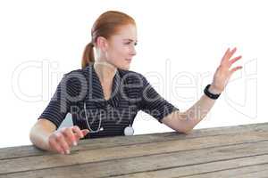 Female doctor touching imaginary screen at table