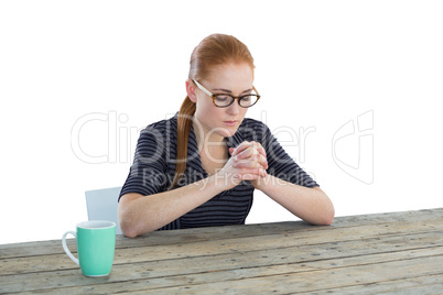 Businesswoman sitting with hands clasped
