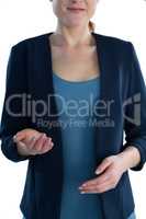 Mid section of smiling businesswoman gesturing during presentation