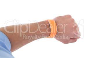 Cropped hand of businessman wearing orange smart watch