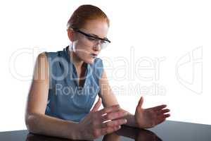 Young businesswoman gesturing while wearing smart glasses