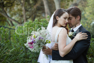 Romantic couple embracing in park