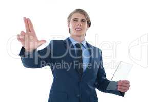 Businessman holding glass interface while touching imaginary screen