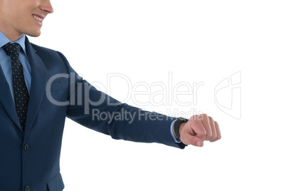 Mid section of smiling businessman with smart watch