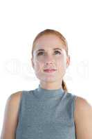 Close up of happy thoughtful young businesswoman looking up