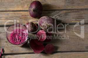 Beetroot and beetroot juice on wooden table