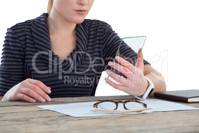 Mid section of businesswoman using transparent glass interface