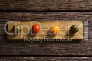 Various tomatoes arrange in wooden tray