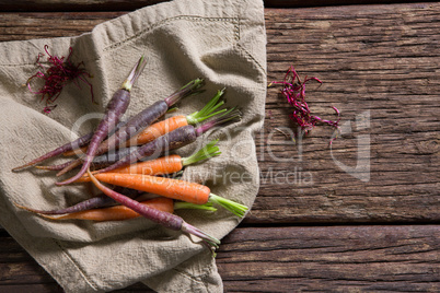 Fresh carrots on napkin