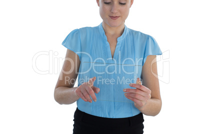 Smiling businesswoman using transparent glass interface