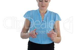 Smiling businesswoman using transparent glass interface