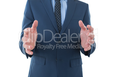Mid section of businessman wearing suit while marketing invisible product