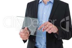 Mid section of businessman using transparent glass interface