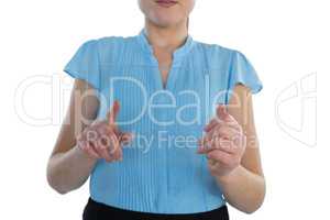 Mid section of businesswoman using transparent glass interface
