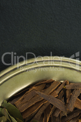 Cinnamon and bay leaf in tray