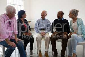 Friends talking during discussion in art class