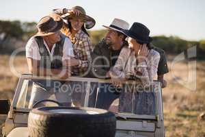 Happy friends enjoying during safari vacation