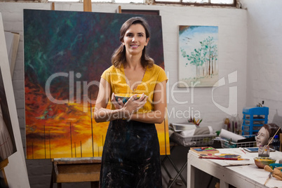 Woman holding a bowl in drawing class