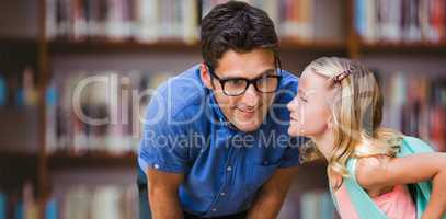 Composite image of girl whispering in male teacher ear