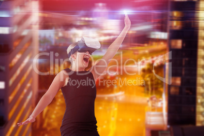 Composite image of businesswoman jumping while looking through virtual reality simulator over white