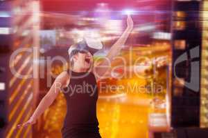Composite image of businesswoman jumping while looking through virtual reality simulator over white
