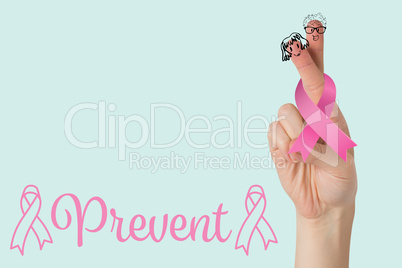 Composite image of pink breast cancer awareness ribbon on cropped hand of woman