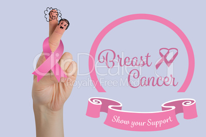 Composite image of cropped image of hand with breast cancer awareness ribbon