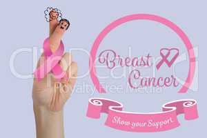 Composite image of cropped image of hand with breast cancer awareness ribbon