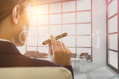 Composite image of businesswoman holding cigar