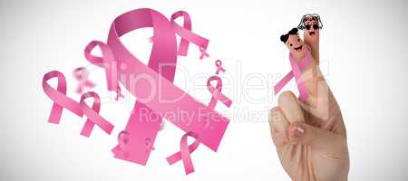 Composite image of cropped hand of woman with pnik breast cancer awareness ribbon