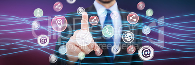 Composite image of businessman pointing his finger at camera