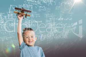 Composite image of portrait of boy holding wooden toy airplane