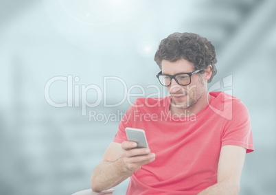 Man holding phone in station