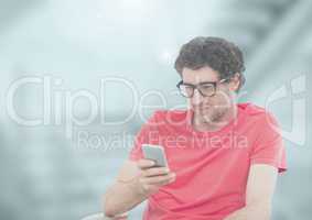 Man holding phone in station