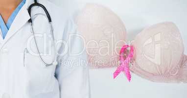 Breast cancer doctor and pink awareness ribbon on bra