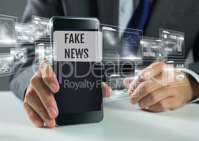 Holding phone with Fake news text and interface