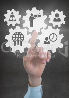 Hand interacting with people in cogs graphics against grey background
