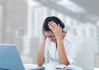 Businesswoman with bright city background