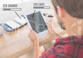 Man on tablet with Likes and shares status bars
