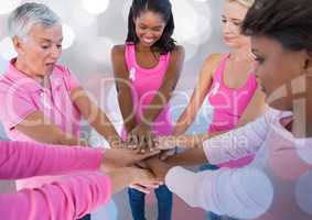 Breast cancer awareness women putting hands together